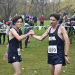 Captain Naci Konar-steenberg congratulates sophomore Sandro Fusco on a great race. Konar-steenberg achieved a personal record of 19:14.5 and placing 46th. He said, "That was my last race in high school, and I just feel like I did everything I wanted to do".